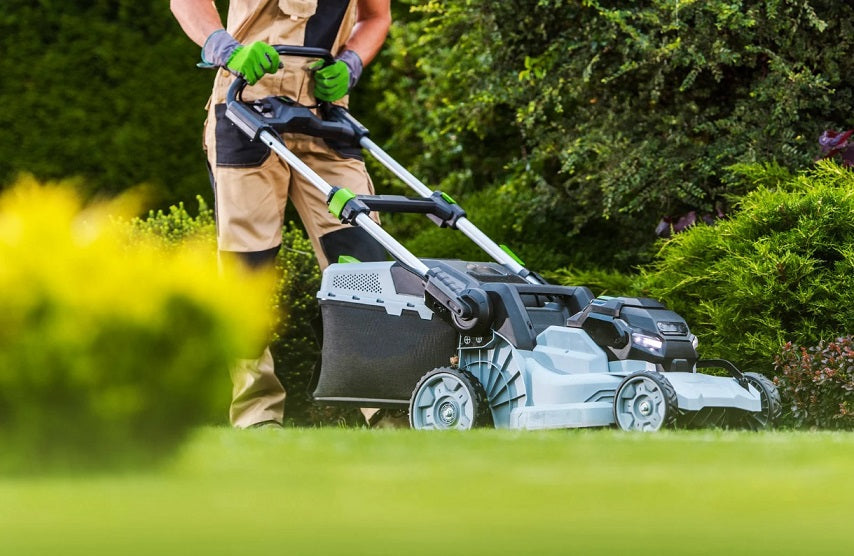 Segway Navimow robot lawn mower cutting grass in garden
