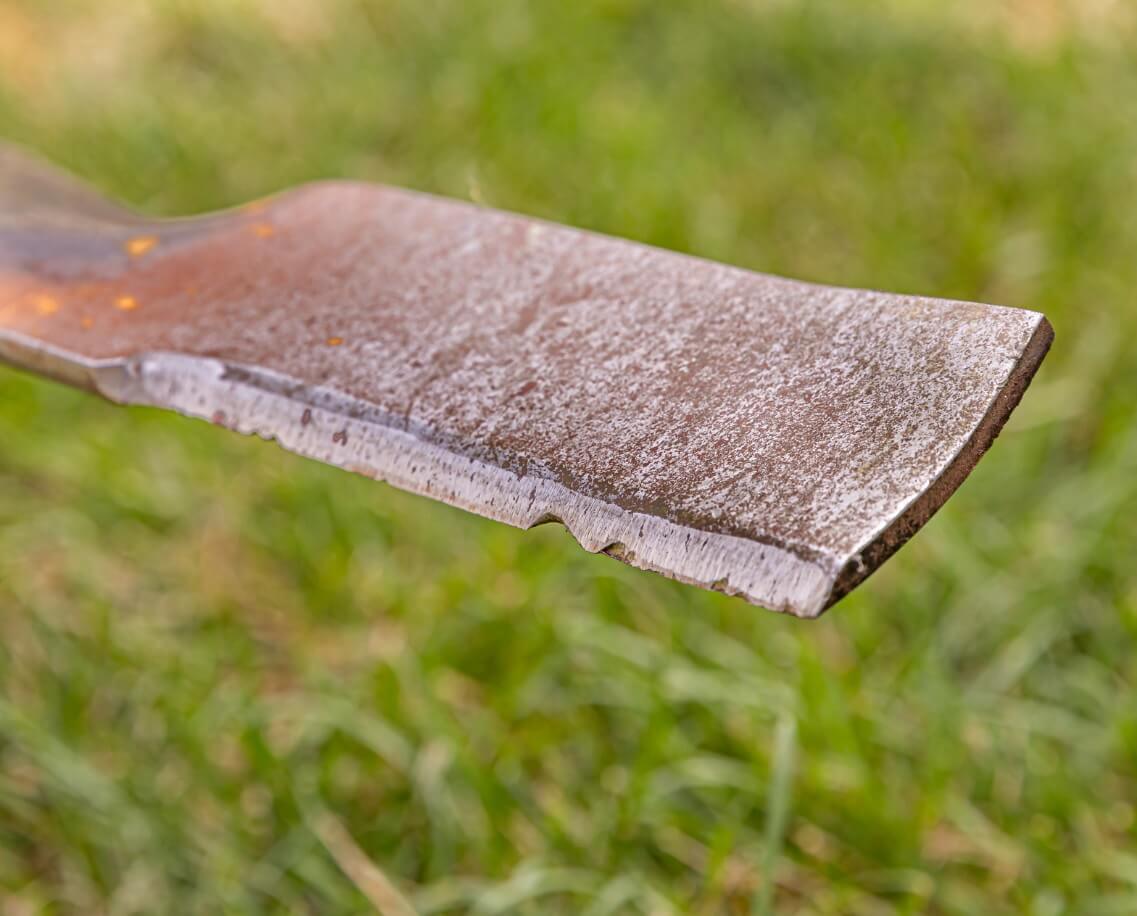 Damaged lawnmower blade Segway Navimow close-up outdoors