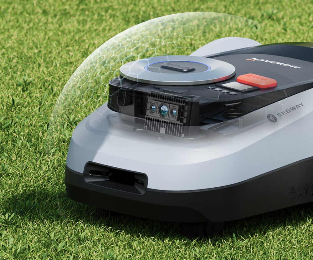 Segway Navimow robot lawn mower mows the lush green lawn.