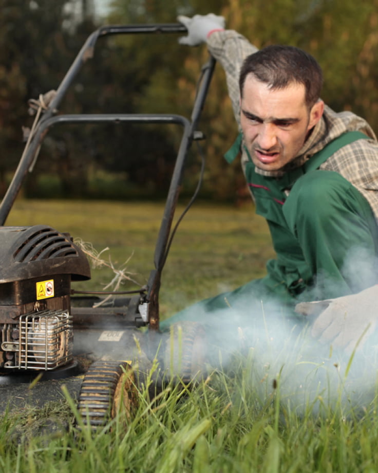 Man with smoking mower needs Navimow i105E robot lawn mower.