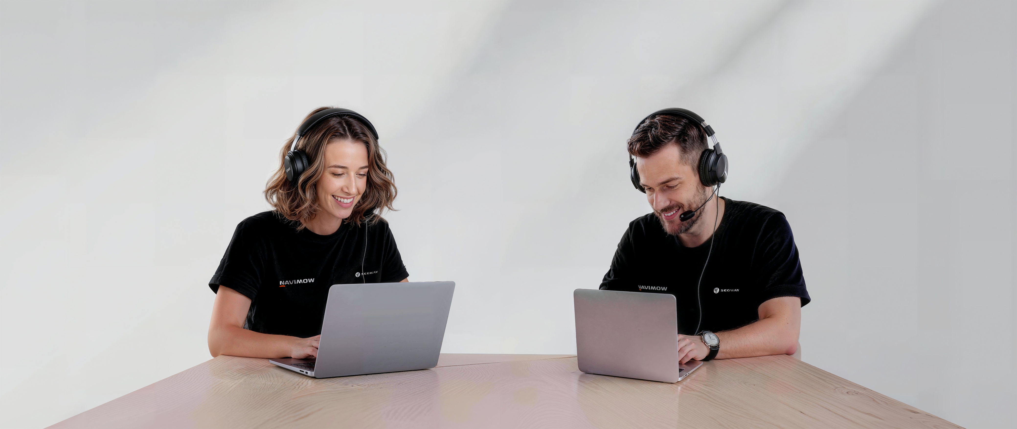 Segway Navimow i105E robot lawn mower team members working hard.