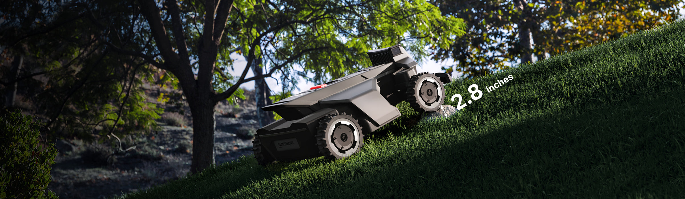 Navimow i110N robot lawn mower climbing a steep green hill.
